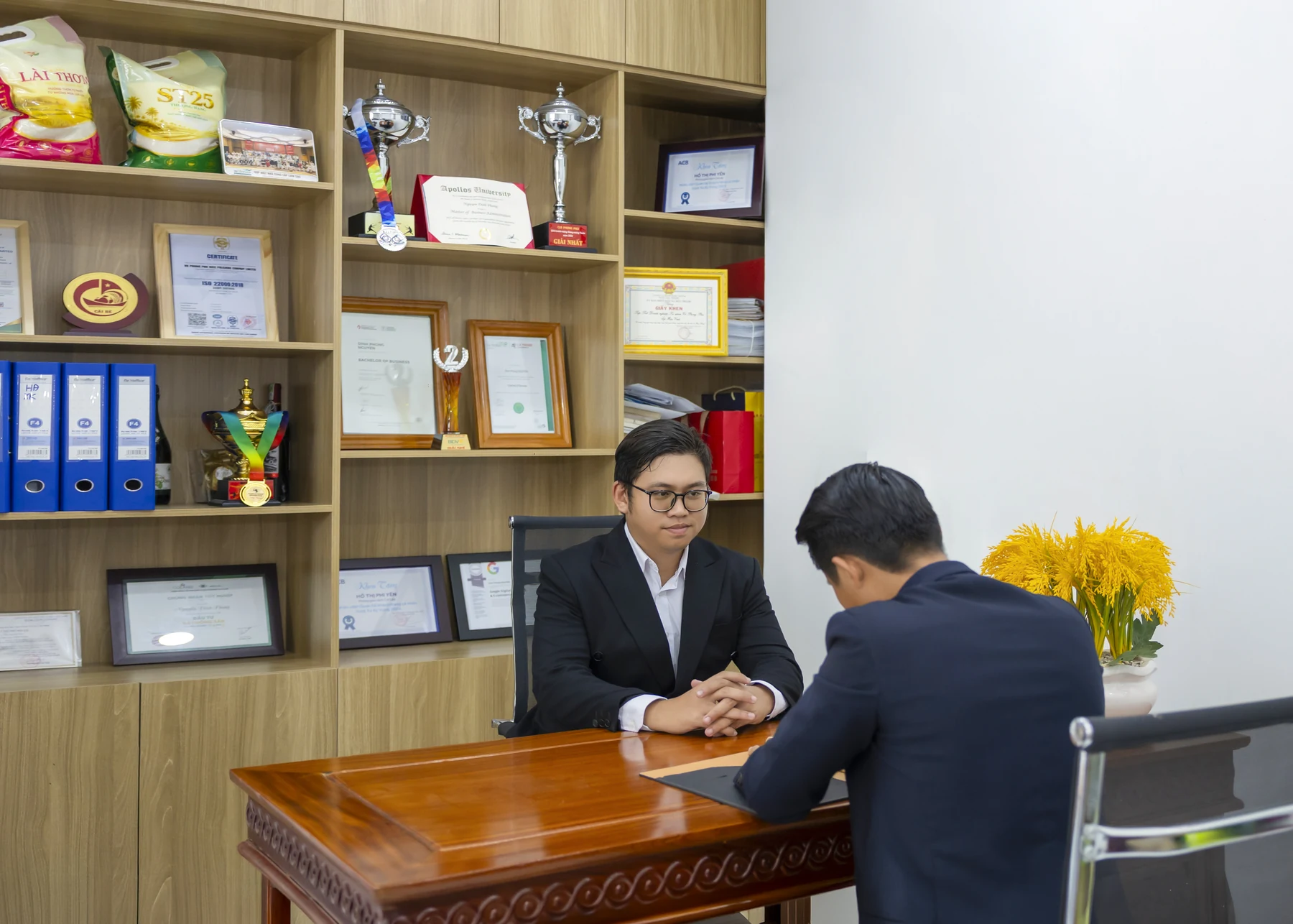 Discussing sourcing requirements at the company office.